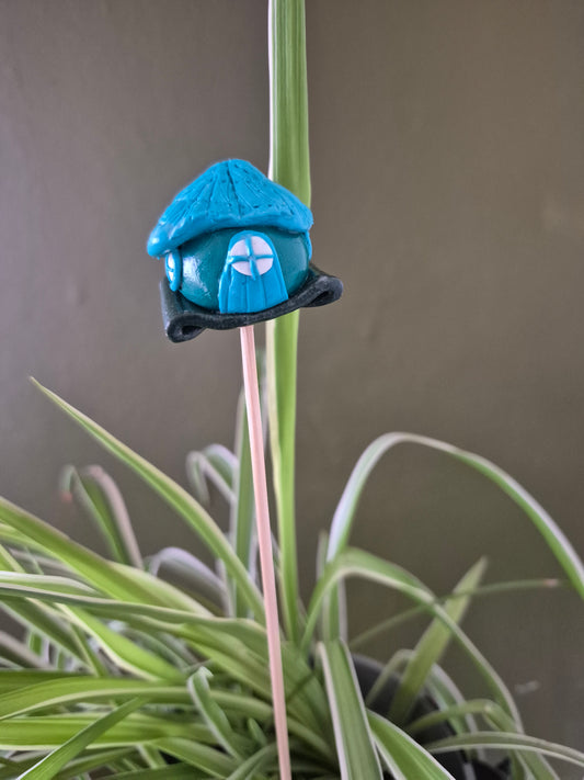 Blue roofed fairy house.