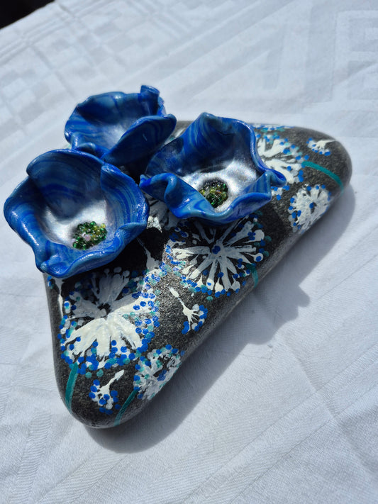 A trio of blue flowerbee cups