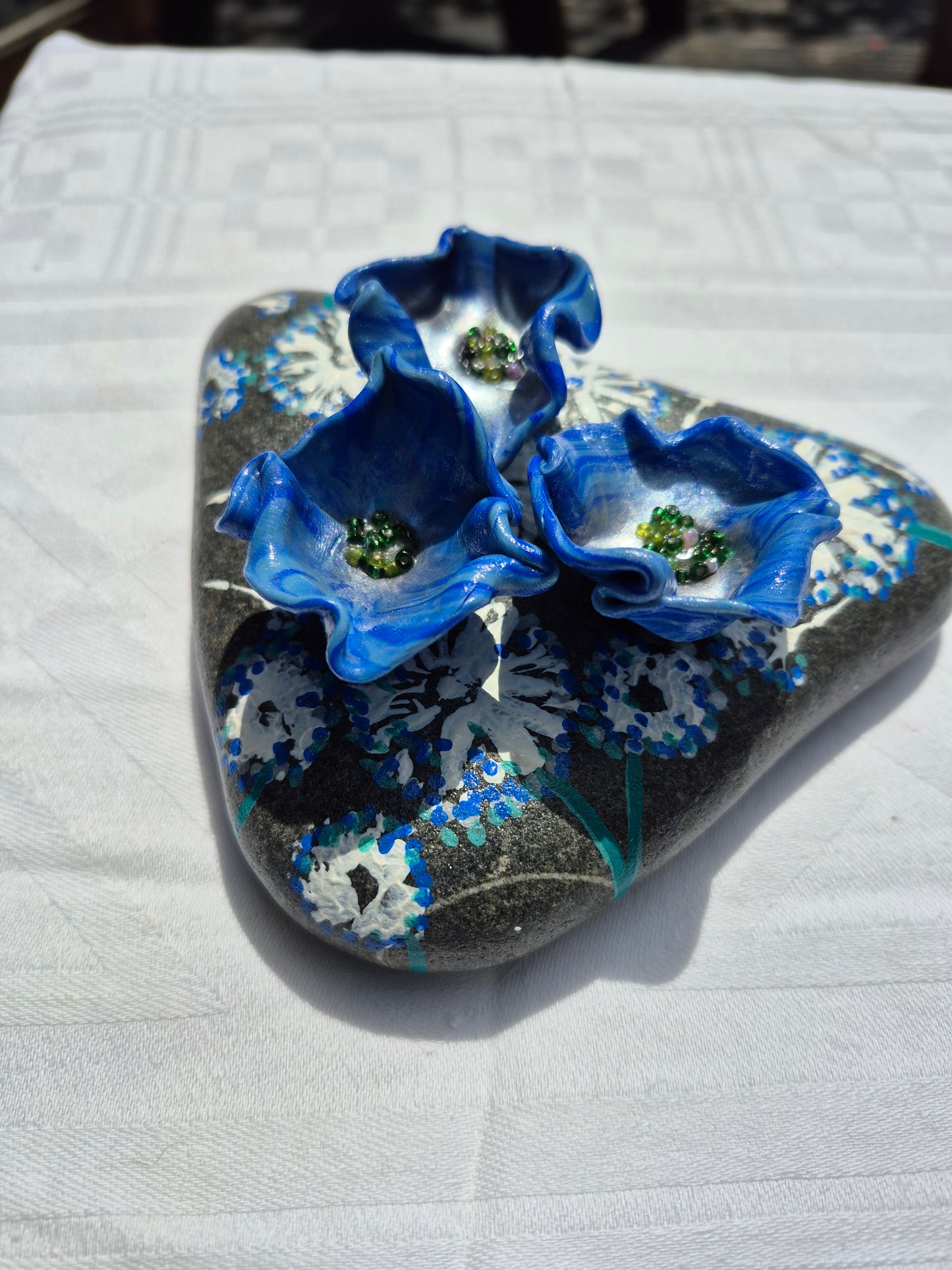 A trio of blue flowerbee cups