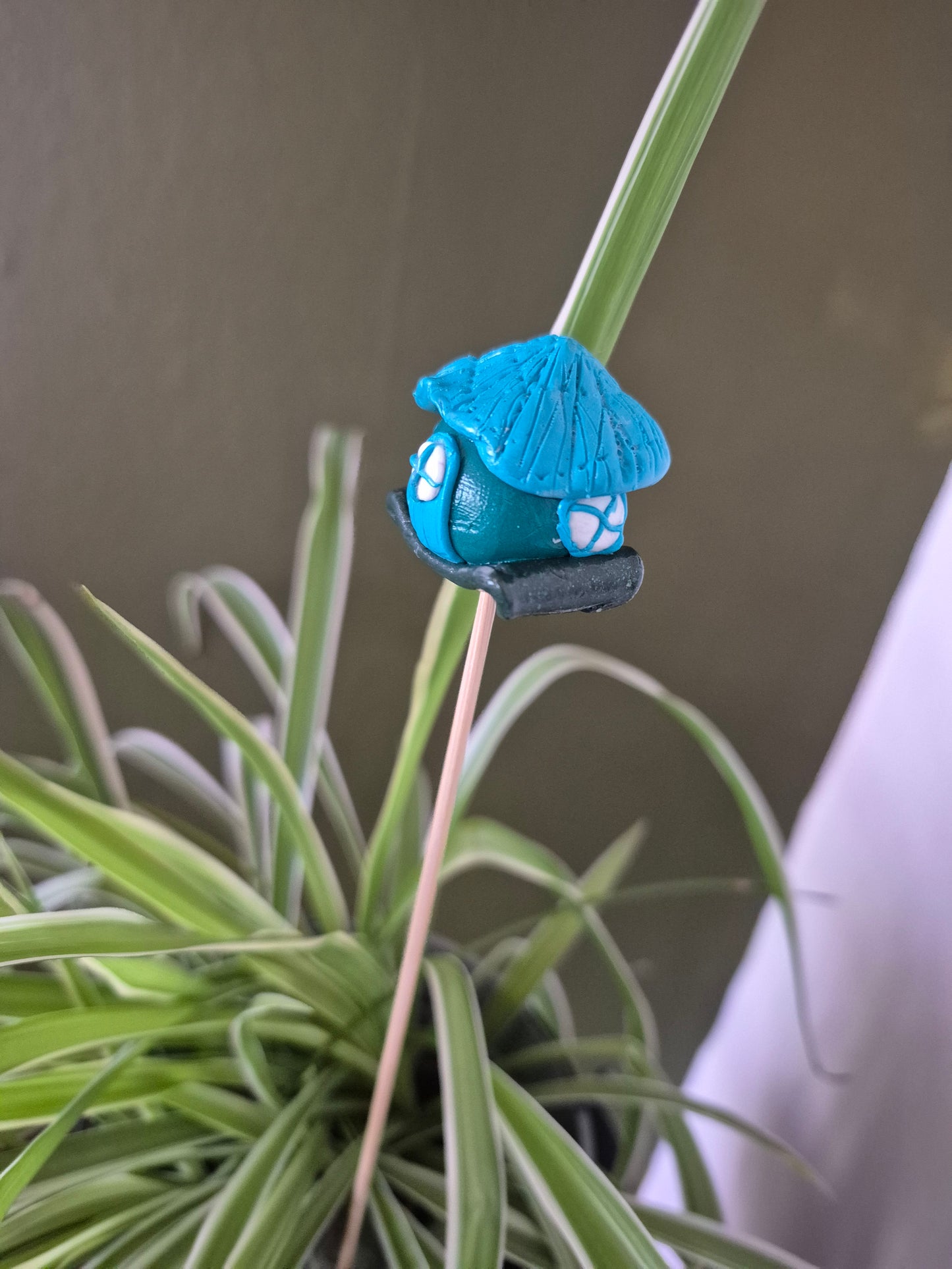 Blue roofed fairy house.