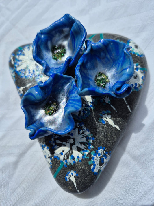 A trio of blue flowerbee cups
