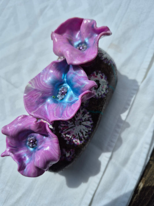 A trio of flowerbee pot